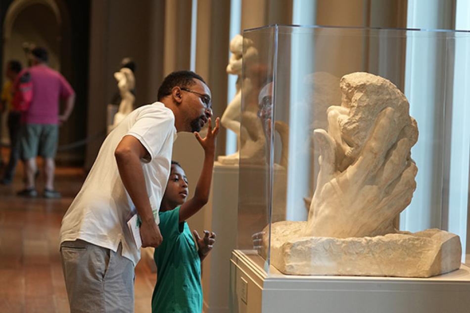 Visitors enjoy artwork in the National Gallery's West Building