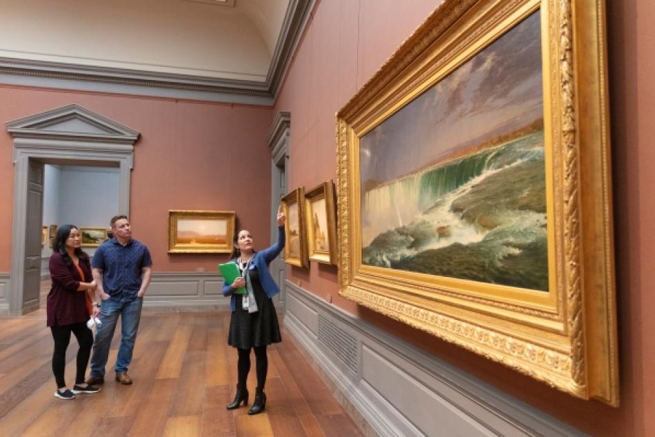 Visitors enjoy artwork in the National Gallery's West Building