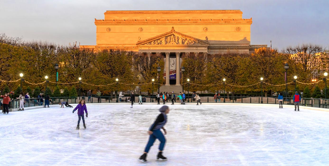 image: skaters on the National Gallery of Art ice rink